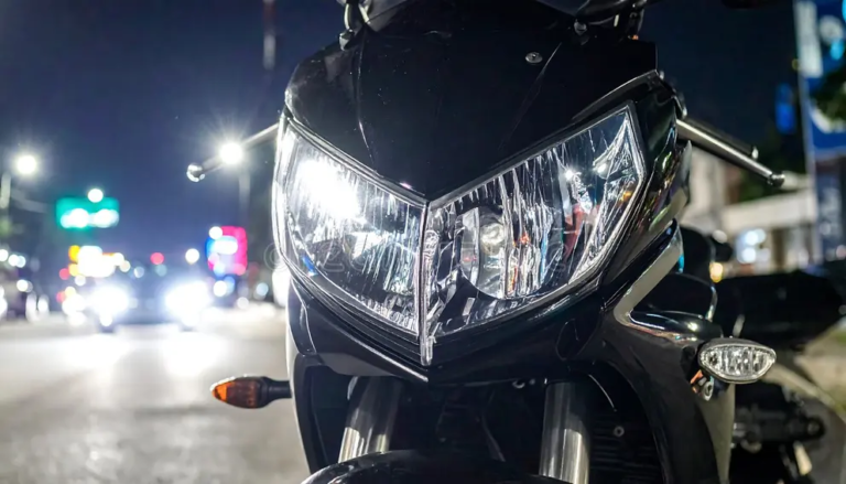 closeup-shot-motorcycles-headlight-night-illuminating-road-powerful-modern-evoking-freedom-speed-urban-adventures-382069563